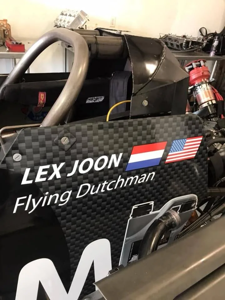 LEX JOON, Flying Dutchman, with the Dutch and American flags on the side of the car