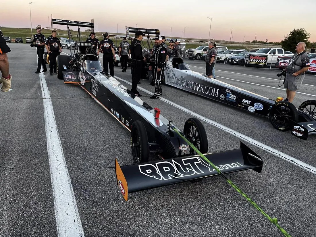Lex Joon's Top Fuel car in the staging lanes with the crew