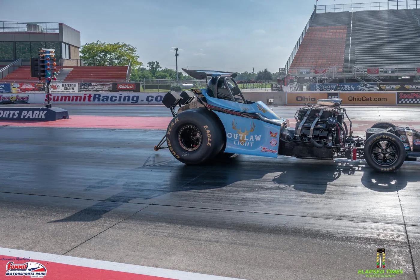 Paul Miller's blue #330 Fuel Altered going down the track at Norwalk