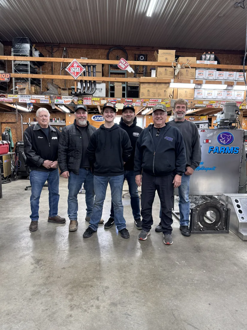 The Dove Motorsports crew lined up in the shop