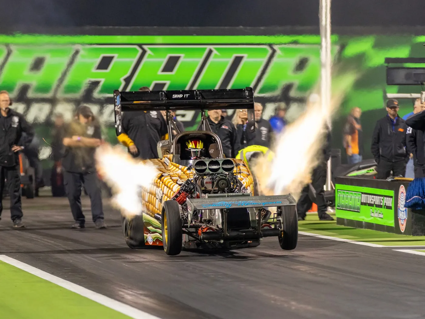 Pete Dove's corn-livery Fuel Altered launching at Darana Motorsports Park with header flames